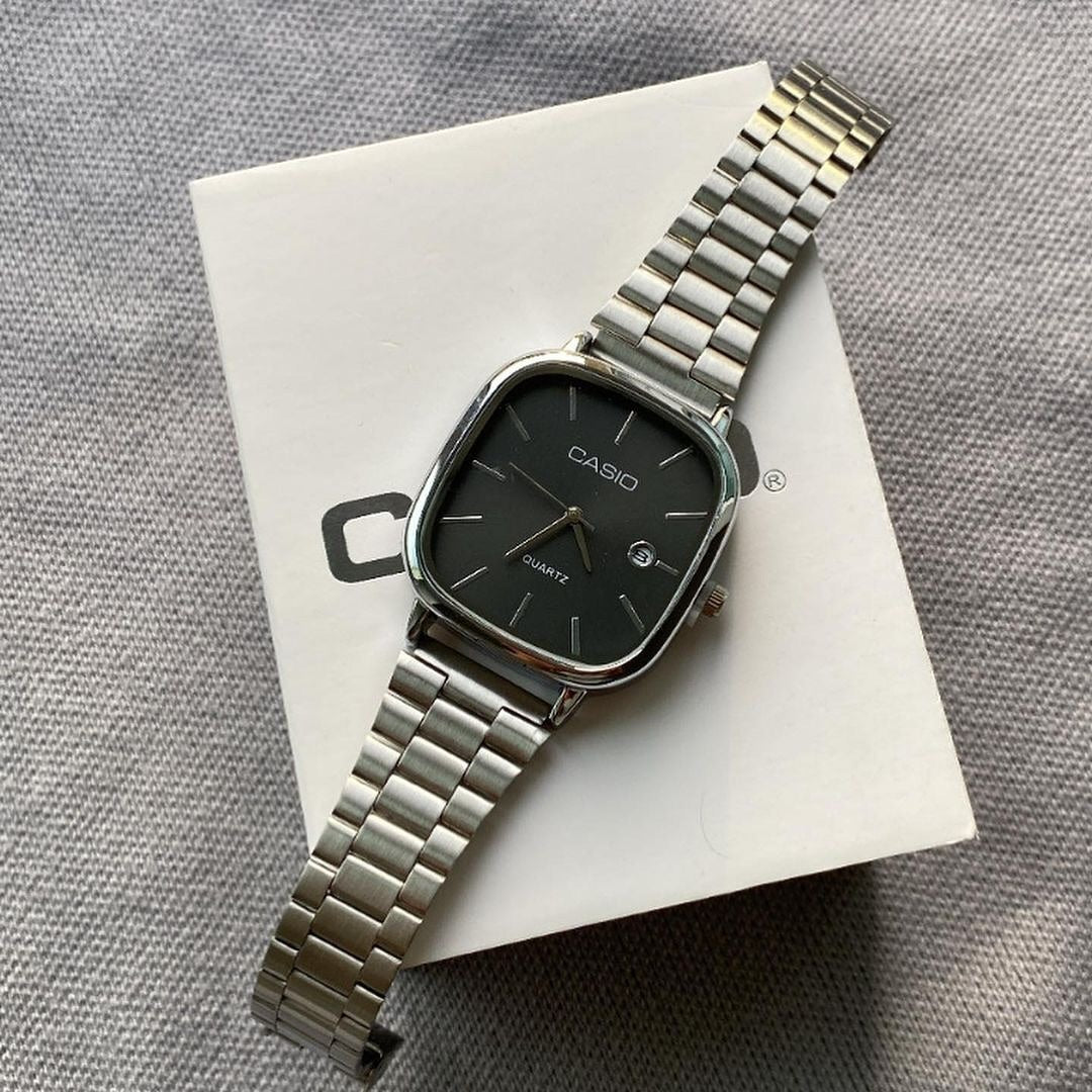 Casio - Silver with a black dial
