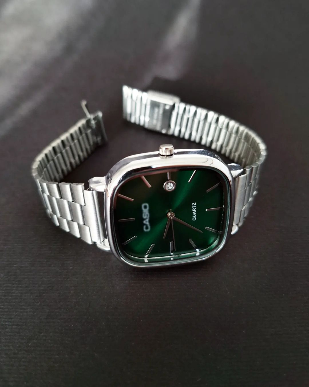 Casio - Silver with a green dial