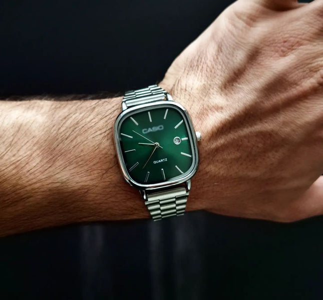 Casio - Silver with a green dial