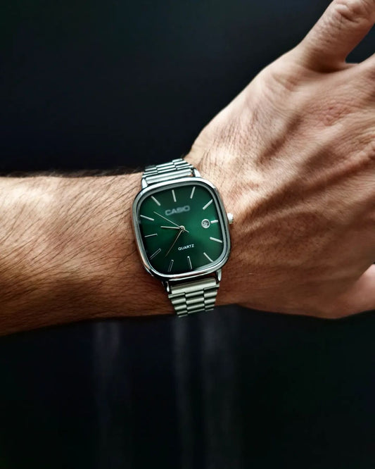 Casio - Silver with a green dial