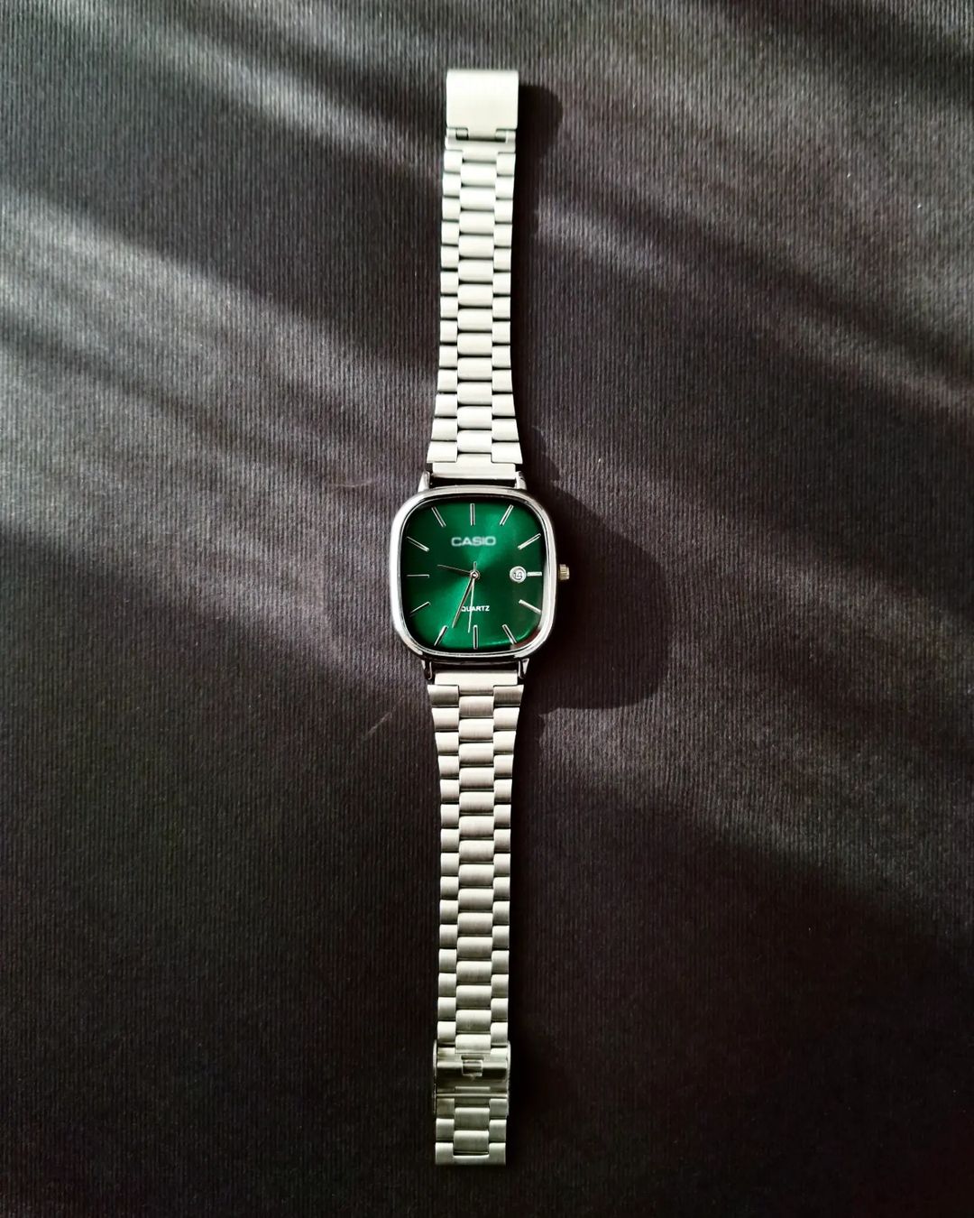 Casio - Silver with a green dial