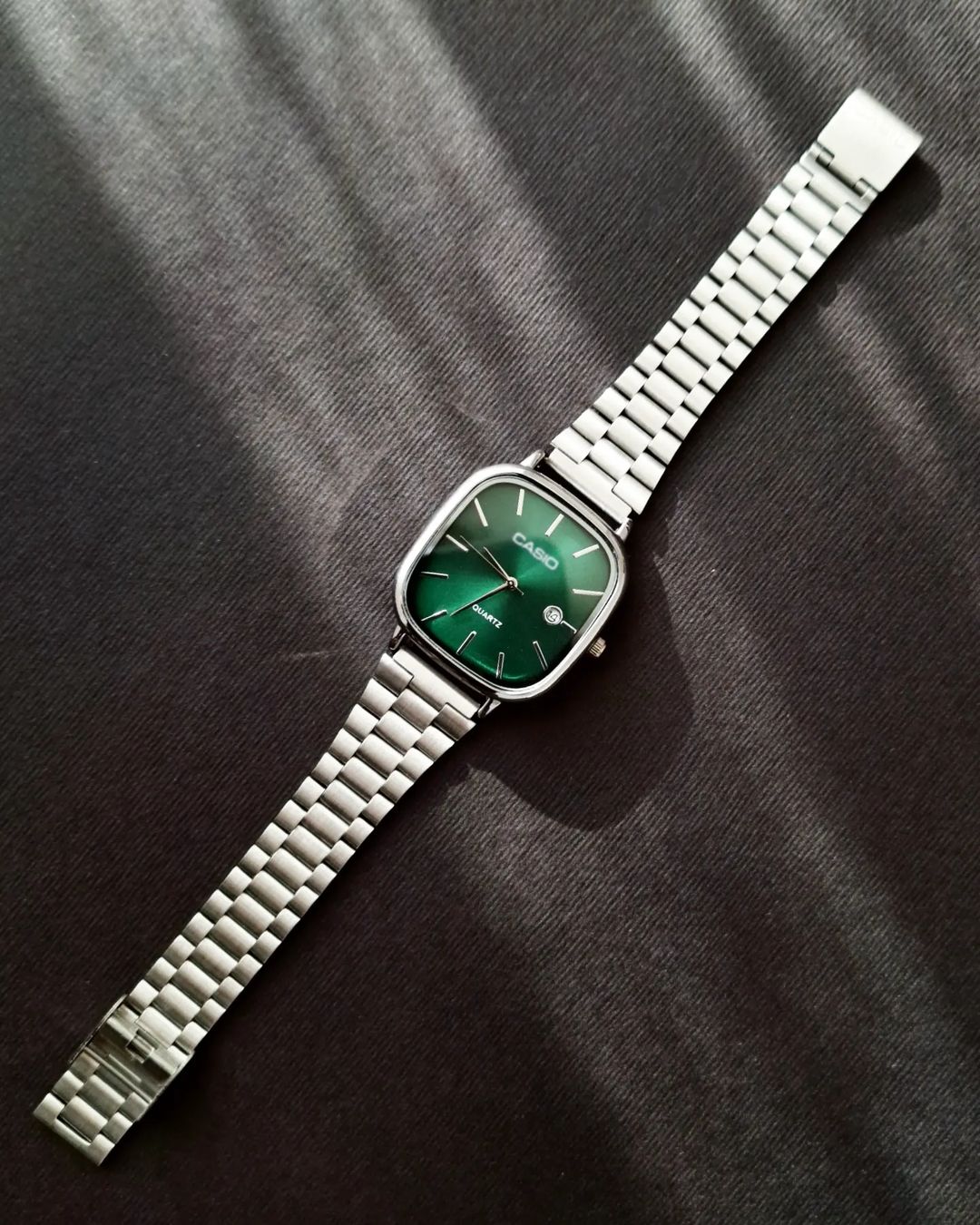 Casio - Silver with a green dial