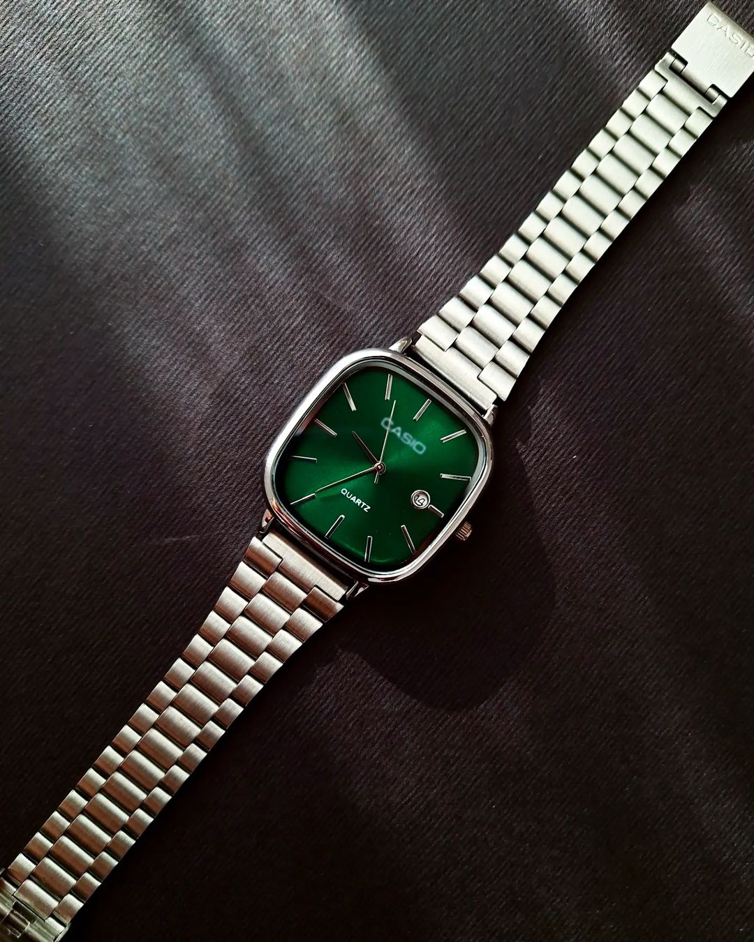 Casio - Silver with a green dial